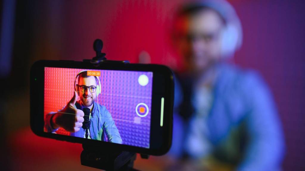 Content creator recording a video for social media to improve AI search visibility