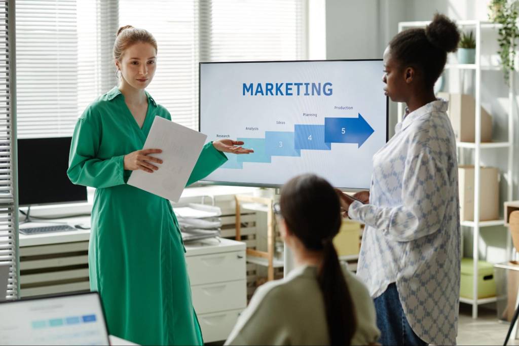 A marketing professional presenting customer insights and segmentation strategies to improve marketing performance and data-driven campaigns.