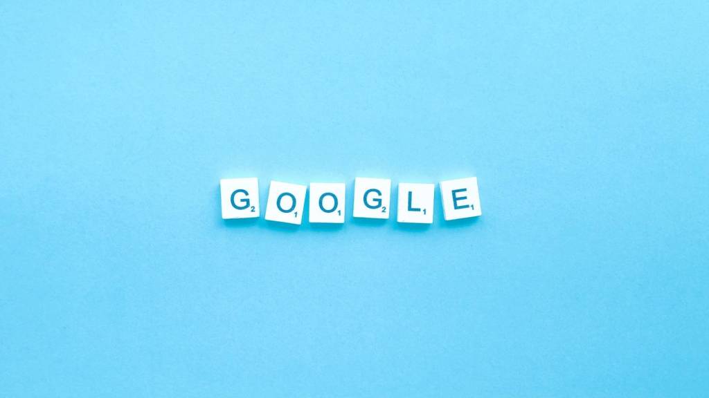 Scrabble tiles spelling Google on a blue background, representing SEO and search ranking goals for 2025 content marketing.