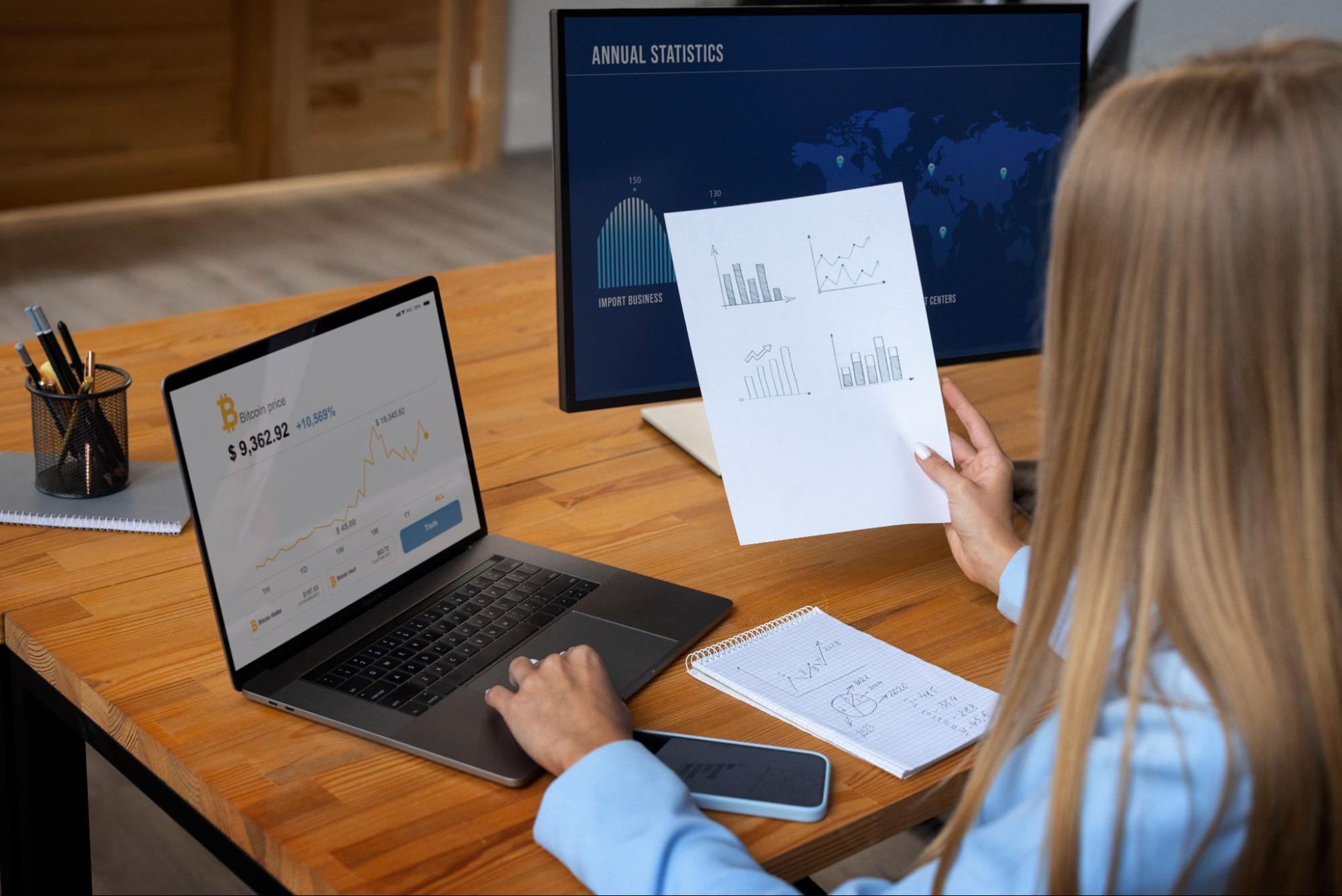 A business professional reviewing a marketing analytics dashboard on a laptop, analyzing key performance metrics and digital marketing optimization trends.
