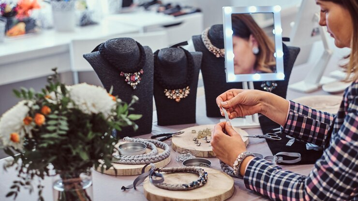 Woman organizing her jewelry store to create content for maximum SEO visibility on her e-commerce website