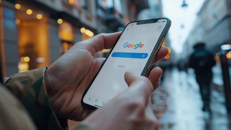 User performing a mobile search on Google, highlighting the importance of mobile-first indexing in SEO for Google's new crawler.