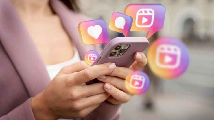A woman holding a phone showing Instagram reactions using the Instagram music feature, symbolizing staying competitive on the platform