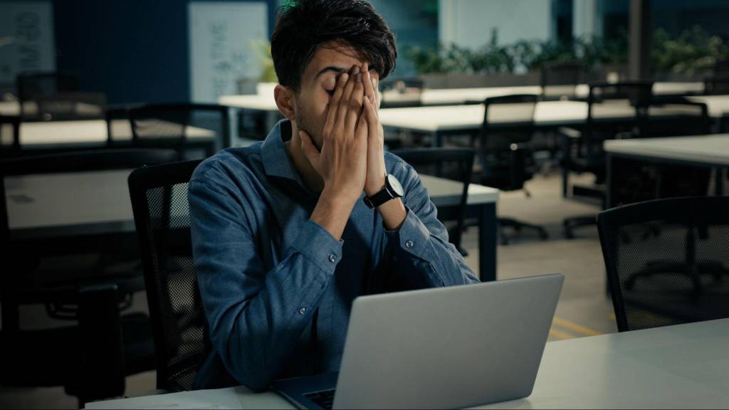 Business owner frustrated by poor website performance typical of a silent sales killer website
