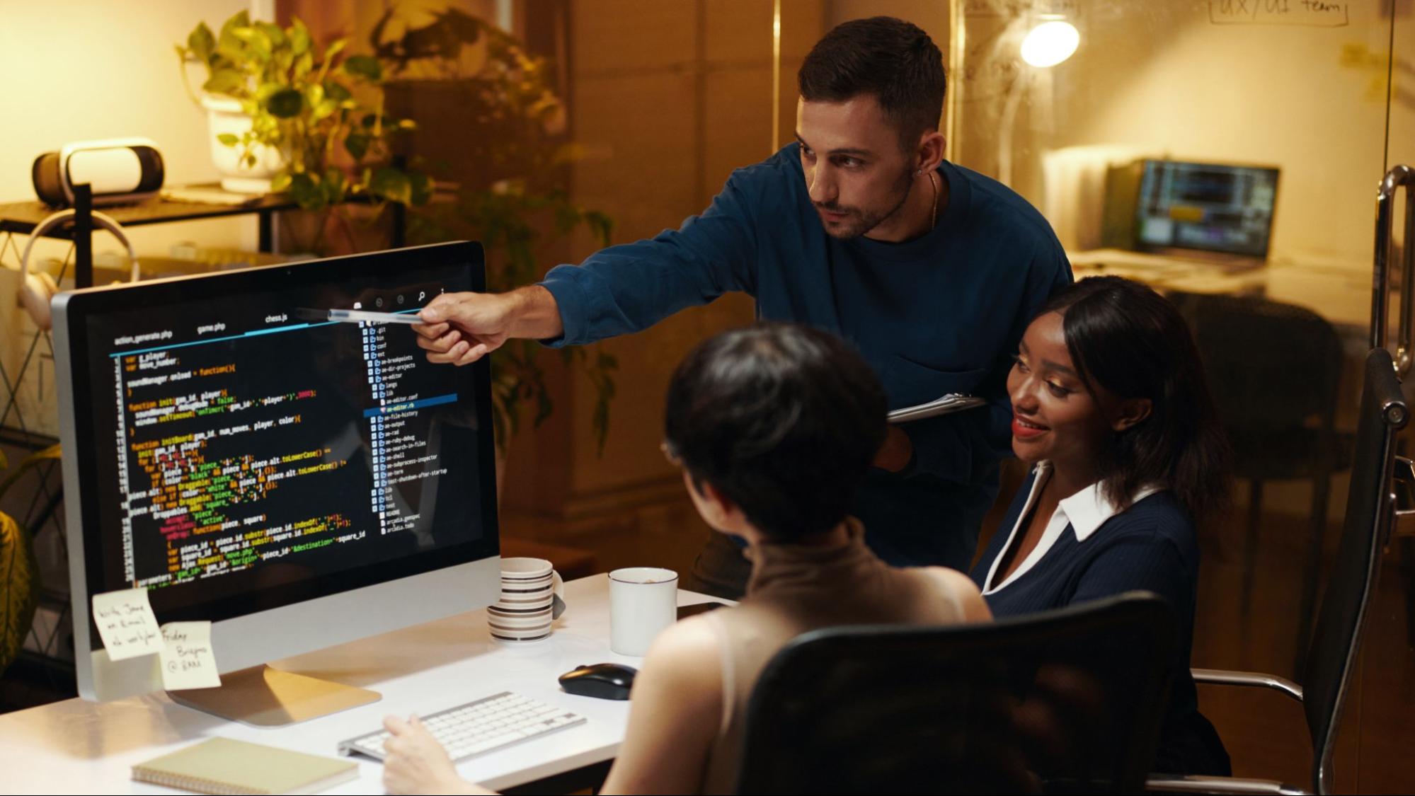 Web development team collaborating to fix issues causing a silent sales killer website