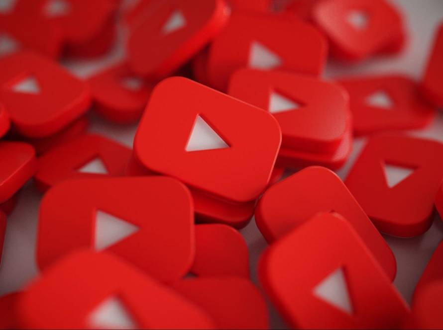 Red 3D YouTube play buttons symbolizing video content and online marketing