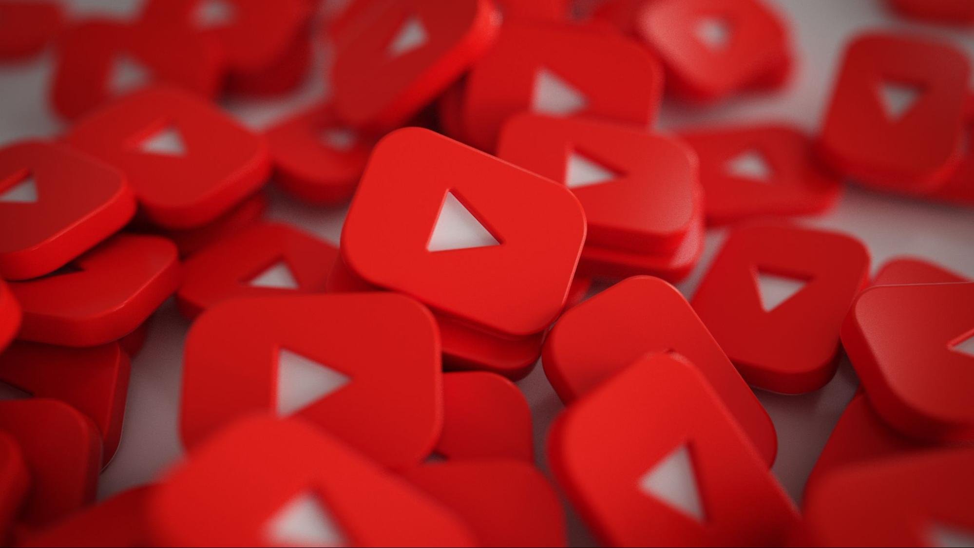 Red 3D YouTube play buttons symbolizing video content and online marketing