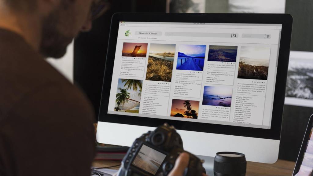 Marketer reviewing social media content on a desktop computer to improve brand visibility and digital presence for a Florida business.