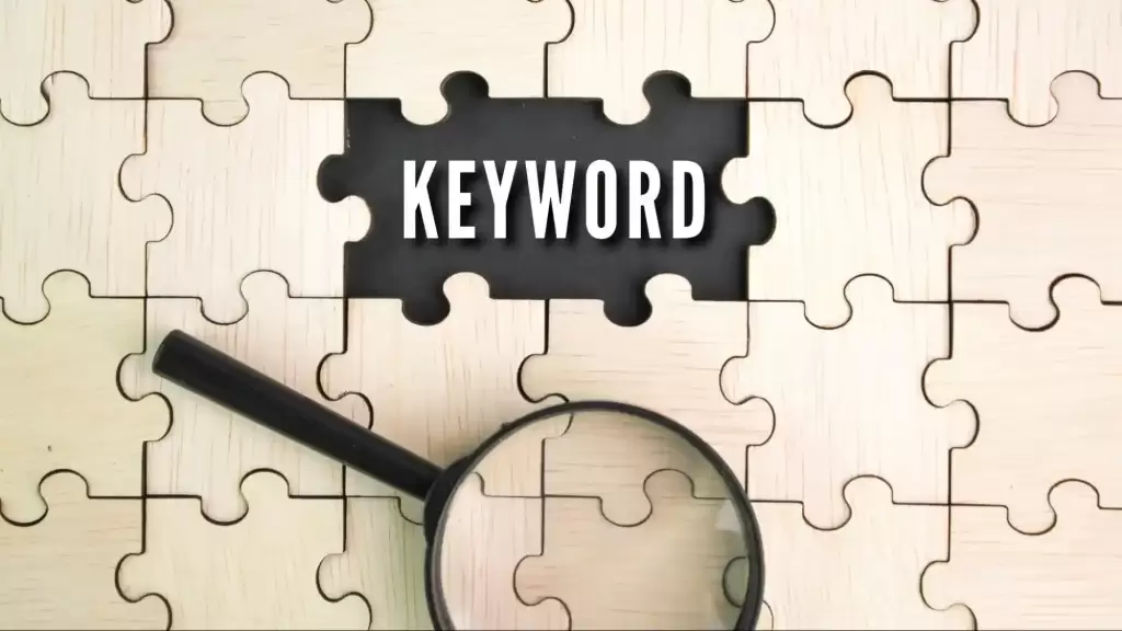 A wooden puzzle with a magnifying glass focusing on the word 'KEYWORD', representing how Expresso Company helps Florida businesses transition from keyword-centric SEO to AI entity authority.