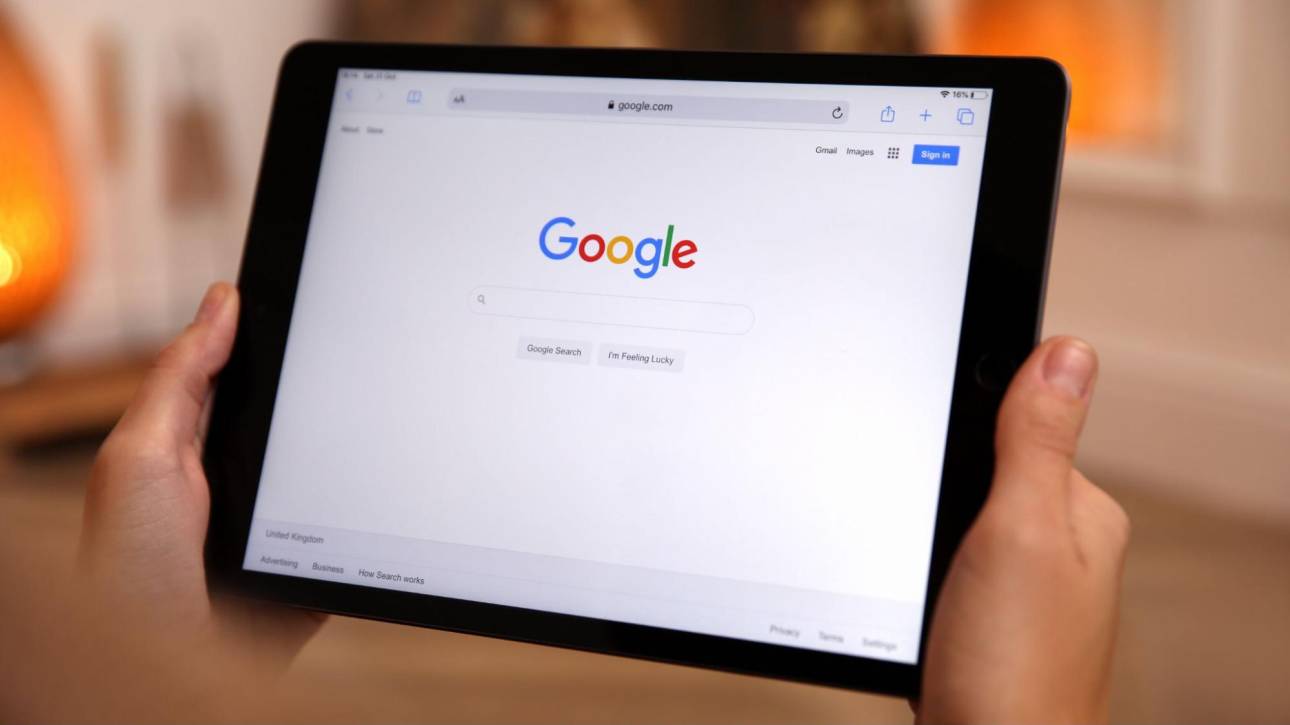Google Search homepage displayed on a tablet for Local Service Ads management.