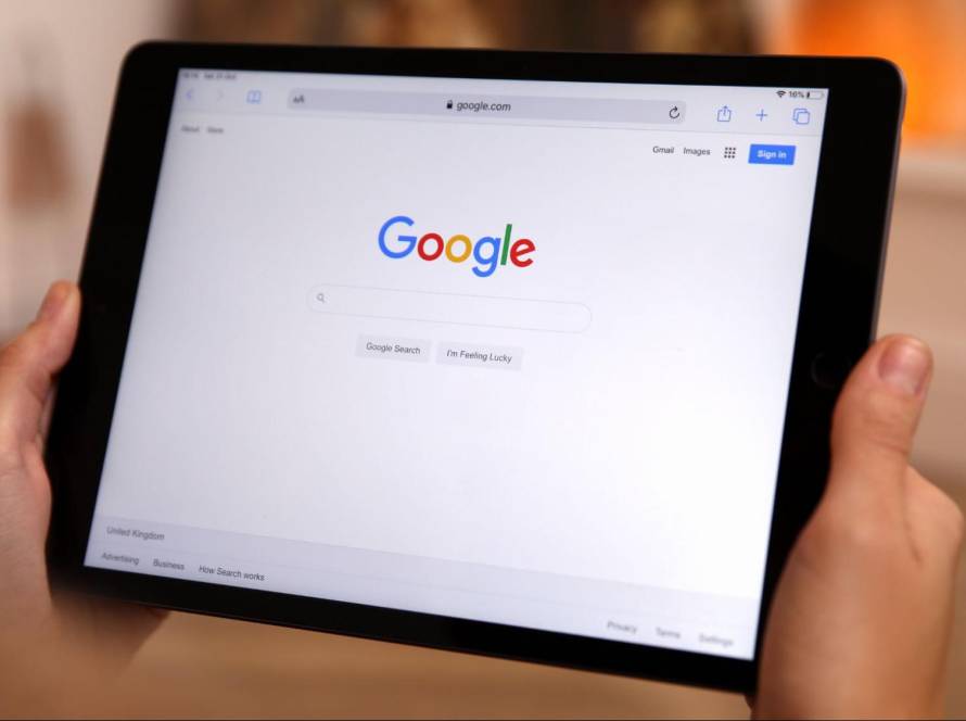 Google Search homepage displayed on a tablet for Local Service Ads management.